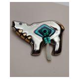 Handcrafted porcelain talisman brooch designed by Kathryn Yauney, featuring a bear motif with 24K  glaze and beads, inspired by Plains Indian traditions.
