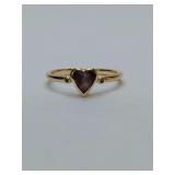 "Dainty" stacking ring style with a heart-shaped stone in a bezel setting, high quality gold tone, smoky purple gemstone center, flanked with small clear stones each side. No markings. Size 5.5.