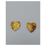 Heart earrings feature a gold-tone finish with intricate floral scrollwork detailing.