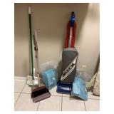 Oreck vacuum cleaner with replacement bags, broom and standing dustpan and mop