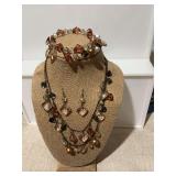 Very pretty beaded earth tone colored necklace, bracelet, and earring set