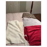Group of mixed throw blankets