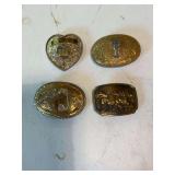 Several western belt buckles