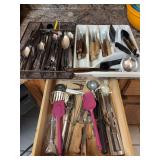 Two trays and one drawer of flatware and utensils