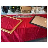 Two picture frames and a coat rack hanger. The black frame is 20“ x 26“. The wood frame is 22 1/2“ x 27“ the hanging coat rack 29“ x 5 1/4“. ￼