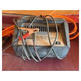 Battery charger with a set of booster cables