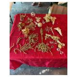 Group of gold and white Christmas ornaments with several angels
