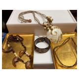 Three necklaces with one bracelet