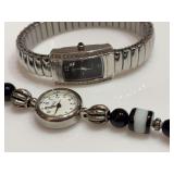 Wrangler Silvertone black dial watch and a Legacy black-and-white beaded watch