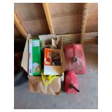 Box of miscellaneous lightbulbs, and two gas cans￼