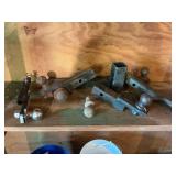 Group of trailer hitches and balls as shown