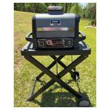 Ninja Woodfire Grill with stand measuring 24 1/2“ x 18 1/2“ x 41“￼