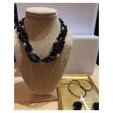 Two necklaces and a pair of clip on earrings