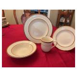 15 piece stoneware set Tahiti pattern.  4 dinner plates, 4 bowls and salad plates with three coffee cups.