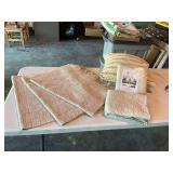 Three tan and white throw rugs 38” x 22” a couple of pillow shams and a pillow