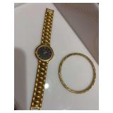 Oscar de la Rento watch with a gold bracelet