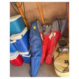 Five ballpark chairs, four red and a blue