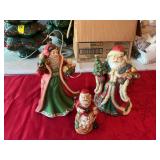 Three porcelain Santas, the one on the right is a music box 6 inches to 11 inches tall