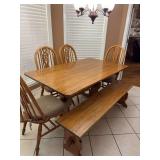 Solid oak dining room table with four chairs and one bench. Hand built by Cedar  Bucket in Oxford .5‘ x 3‘ x 2 1/2 foot. Bench is 5‘x 13 1/2 inches 18 1/2 inches. The chairs are 18“ x 21“ x 