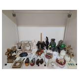 Shelf of primarily bookends. Also includes horse figurines and more.