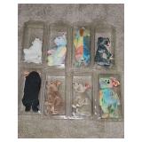 Grouping of eight TY beanie baby bears with hang tags and tush tags in protective cases.