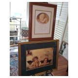 Two framed cherub prints. 22x 17.75 in tall and 13.5x 16.5 in tall.