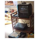 Sylvania 13-in TV with VCR player, RCA VCR player, VHS video cassette recorder player. TV powers on, other VCRs not tested. Also includes TV stand. 16 x 26 x 25 inches tall.