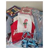 Container of Christmas stockings, Christmas towels, decorative items and more. See all photos.