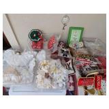 Christmas tree decorations and some napkin rings. Many of the tree ornaments are handmade. Does not include rugs or anything in the large tubs.
