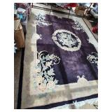 area rug with black as the primary color. Show somewhere on one corner, and Fringe missing from one edge. Needs vacuumed. 95 x 124 in Stripes appearing on rug are from the sun shining through the sunr
