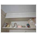 Contents on shelf. 11 in angel with bunnies, small Italian hand paint and vase, Nativity by Roman, nesting boxes, and more. See all photos
