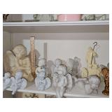 Shelf of Angels. Some porcelain, some resin, some glass.