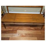 Solid wood cocktail table. 60 x 22 x16 in tall. Unable to read manufacture.