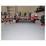 Stocking holders, Santa Claus tart holders, ceramic box, and two porcelain trees.