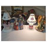 Lighted figurines, candle holder, and very small lamp. Mary Joseph and jesus, an angel, three acrylic snowmen that is a candle holder, and a one cup green mason jar that's been repurposed as a lamp.