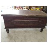 Vintage walnut-finished cedar chest, likely manufactured by Cavalier or Lane in the 1920s-1940s, features ornate Jacobean-style carved paneling and decorative feet. Needs some TLC on the finish. No ke