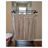 Portable clothes rack with two garment bags. 40x17 x61 in tall.