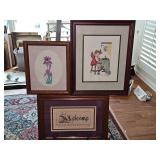 Three framed cross stitch panels. 9.5 x11.5 in tall, 12.5x15.75 in tall and 16x 12 in tall.