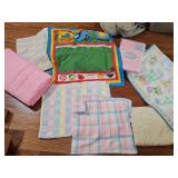 Grouping of baby blankets and throws.