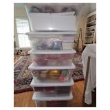 Six 15 x 11 x 6 in tall containers with Christmas ornaments and decor.