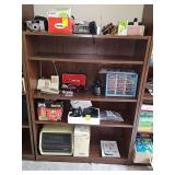 laminate bookshelf with three adjustable shelves. 36 x 12 x 48 in tall. Contents are not included.