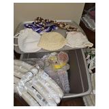 Tub of miscellaneous items. Vintage handcrafted full size granny square bed coverlet,  placemats and coasters, handmade purses, padded hangers, and more. See all photos.