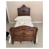 Antique French, twin size bed with linens.