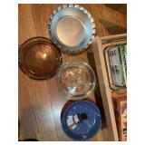 Contents of bottom drawer.. assortment of pie plates and other kitchen goods