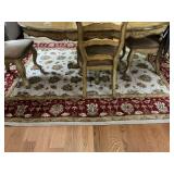 Area Rug under kitchen table. Two Corrners have damage as shown.
