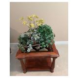 Floral decoration. Is actually three pots sitting in the larger.