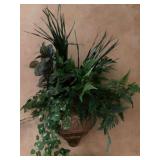 Faux greenery in gold metal wall planter. The planter is 12” x 12”, the overall floral arrangement is approximately 33” x 30”.