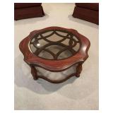 Gordon’s walnut coffee table with smoked glass insert top. 38 inches round by 16 1/2 inches.