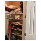 Contents of top shelf in closet and shelves on right of closet. Contains miscellaneous yarns, pillows, materials , Christmas decor, exercise ball and more