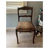 Vintage Rosewood chair with leopard print covered seat. 17 inches wide 33 inches tall